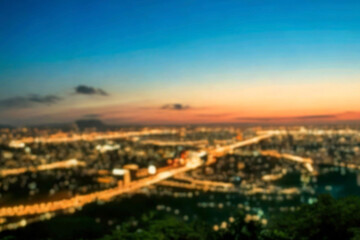 The lights of the night city. Blurred background. Lanterns on the street. big city lights in the twilight evening with blurring. Colorful circles of light abstract. circular bokeh on blue horizon.