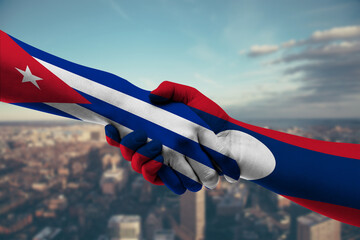 Shaking hands Cuba and Laos