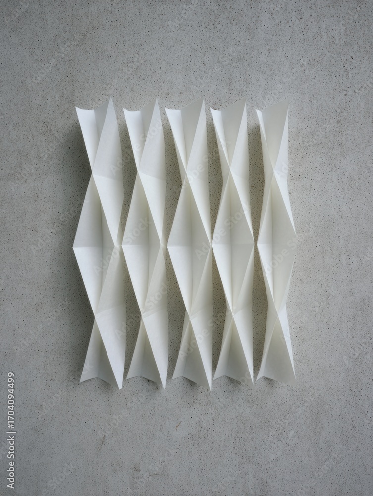 Poster unique white paper art installation with folded geometric patterns on a concrete wall showcasing mod