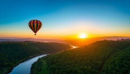 Obraz premium A hot air balloon floats serenely over a winding river and lush green hills at sunrise.