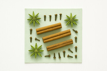 Flat Lay of Aromatic Spices: Cinnamon, Star Anise, and Cloves