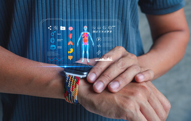 Smartwatch with futuristic health interface showing human body scan and medical icons. Wearable health technology for remote monitoring and digital health management.