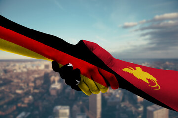 Shaking hands Germany and_Papua New