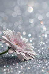 Silver glitter background with shimmering metallic effect and soft bokeh