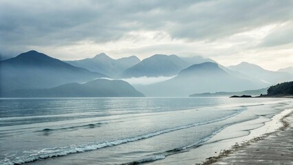 Obraz premium Minimal Soft Focus Seaside with Mountains in Mist Serene Coastal View with Hazy Mountains and Ocean Peaceful Seascape with Soft Light and Rolling Waves Tranquil Landscape of a Misty Shoreline at Da
