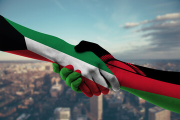 Shaking hands Kuwait and_Malawi