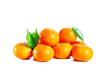 Juicy shiny tangerines with leaves isolated on white background.