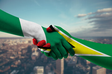 Shaking hands Nigeria and_Guyana