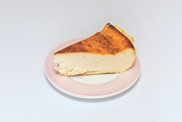 A slice of cheesecake with a crushed biscuit base