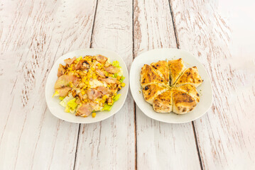 Goat cheese Russian salad with potato, arugula, and cherry tomatoes, dressed with a honey and mustard vinaigrette