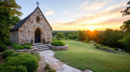 Obraz premium Old stone church bathed in golden sunset light, nestled in greenery and serene surroundings