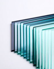 Obraz premium Stacked translucent glass panels with gradient blue and green tones image