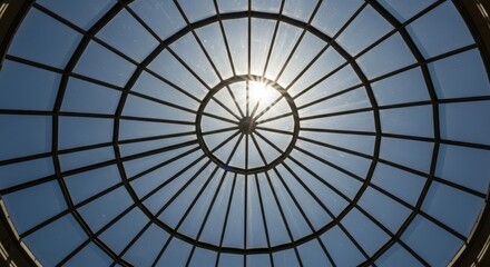 Sunlit glass dome roof with radiating steel framework pattern