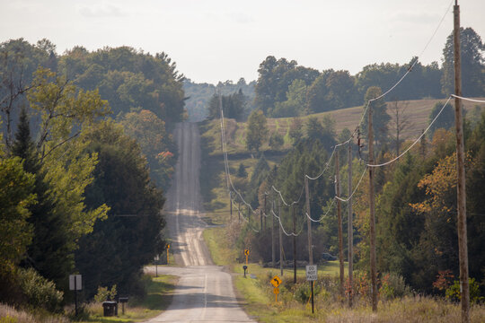 In the hills along a country road with powerlines