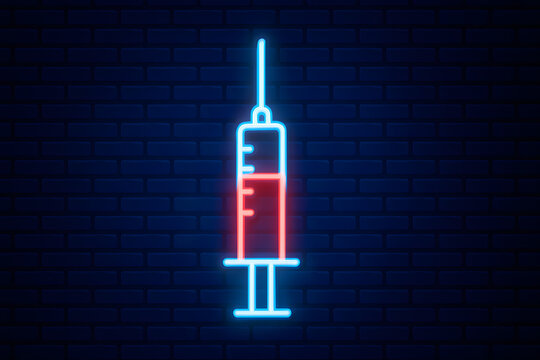 Neon syringe icon glowing on dark brick wall background illustrating medical injection concept, healthcare vaccination symbol with futuristic luminous outline highlighting medicine treatment equipment