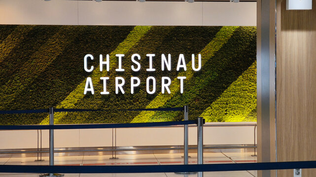 Chisinau, Republic of Moldova,2025. Chisinau airport indoor moss wall decor with modern signage