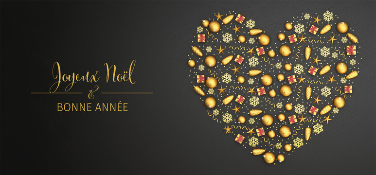 Flat lay golden christmas ornaments arranged as a heart on a black stone plate. French text "Joyeux Noël & Bonne Année" (Merry Christmas & Happy New Year) Web banner