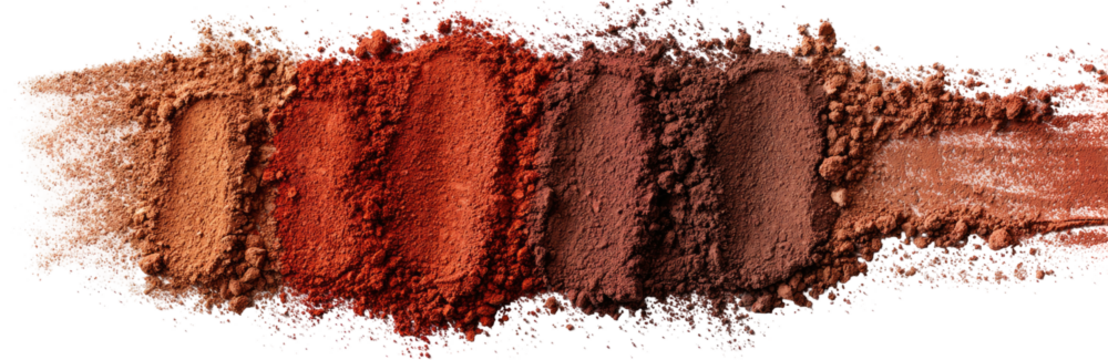 Horizontal swath of various shades of reddish-brown powder