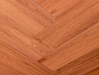 Fototapeta premium Brown Wood Flooring Texture - Elegant Herringbone Pattern for Modern Interior Design, Promotional Material, and Creative Marketing Projects