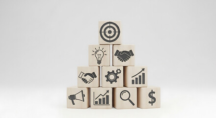 Business growth strategy concept depicted with icons on stacked wooden blocks forming a pyramid structure with target goal.