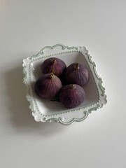 figs on a plate on a white background