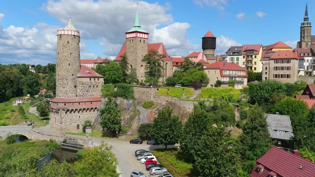 The Panorama captures the charm of an old German town Bautzen with colorful houses, imposing church towers, city fortifications, and a harmonious blend of nature and architecture.