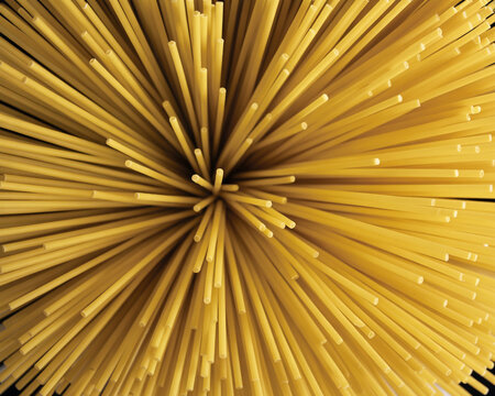 Abstract close-up of uncooked spaghetti strands pasta