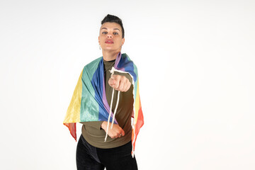 A young woman with a strong attitude holding a pride flag