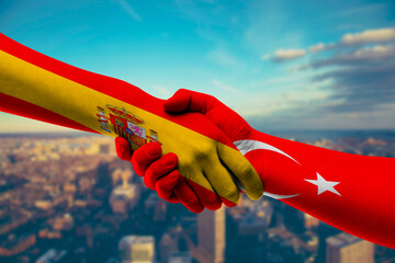 Shaking hands Spain and Turkey