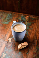Cup of coffee on rustic wooden background. Soft focus. Copy space	