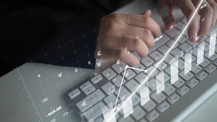 A close-up of hands typing on a keyboard, enhanced by a digital financial graph overlay. This image represents data analysis and growth in a modern professional setting. Copula