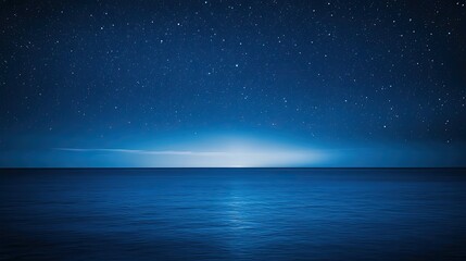 Dark blue ocean and starry night sky