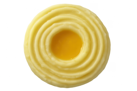 Mashed potatoes forming concentric circles with melted butter in the center on a transparent background