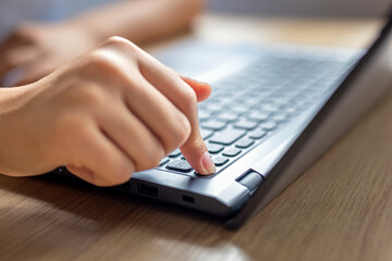 Computer button on and off. Confirmation by button on the keyboard on a laptop when working and studying and social media