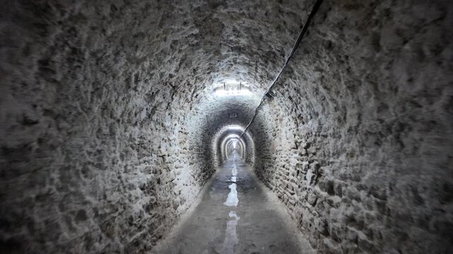 Transylvania, Romania, Aug 12, 2025: Mysterious tunnels of Salina Turda salt mine in Transylvania, Romania, stretch into the illuminated depths, evoking adventure