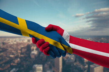 Shaking hands Sweden and Denmark
