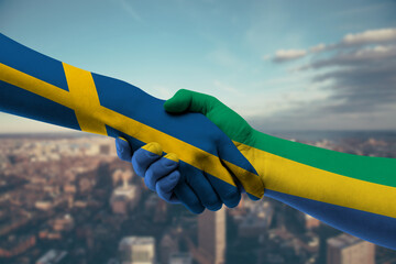 Shaking hands Sweden and Gabon