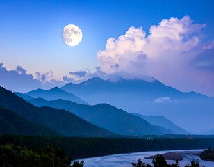 Misty mountains at twilight with full moon