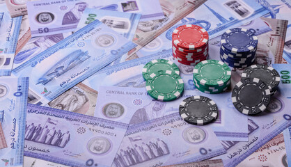 Casino game in the United Arab Emirates, dirham, chips, cards. Gambling in casinos in the Emirates