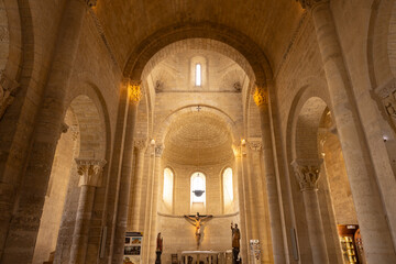 Fototapeta premium Interior of San Martin Church showing arches, columns and crucifix in Fromista, Spain
