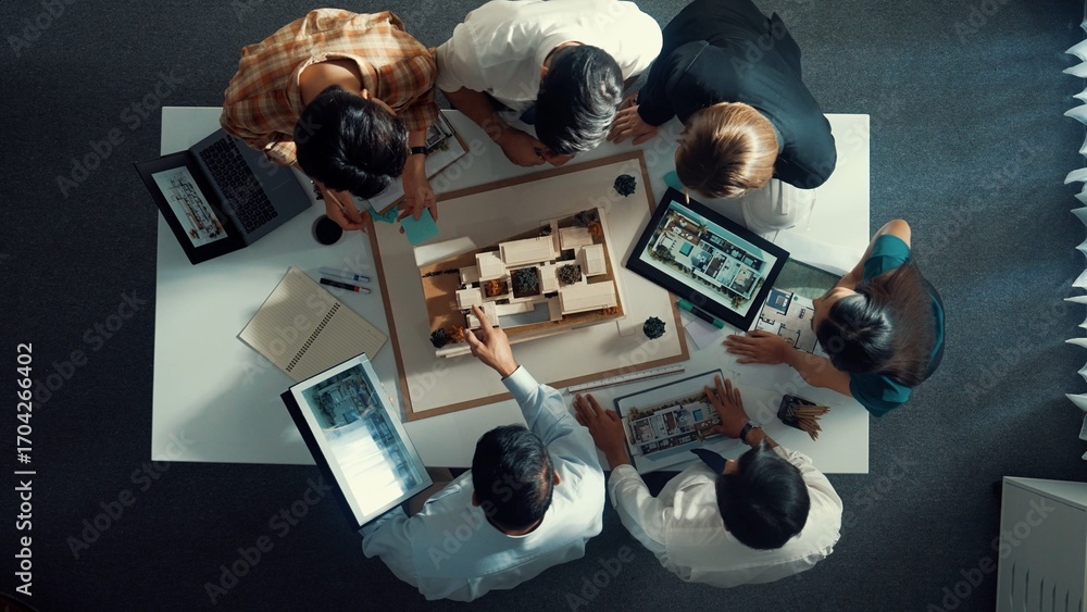 Poster Top down view of manager pointing at house model and explain building design. Aerial view of architect engineer brainstorming about interior construction while tablet display house plan. Alimentation.