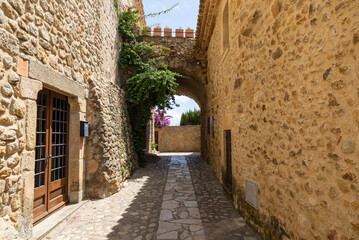 narrow street in the old town Pals, Spain