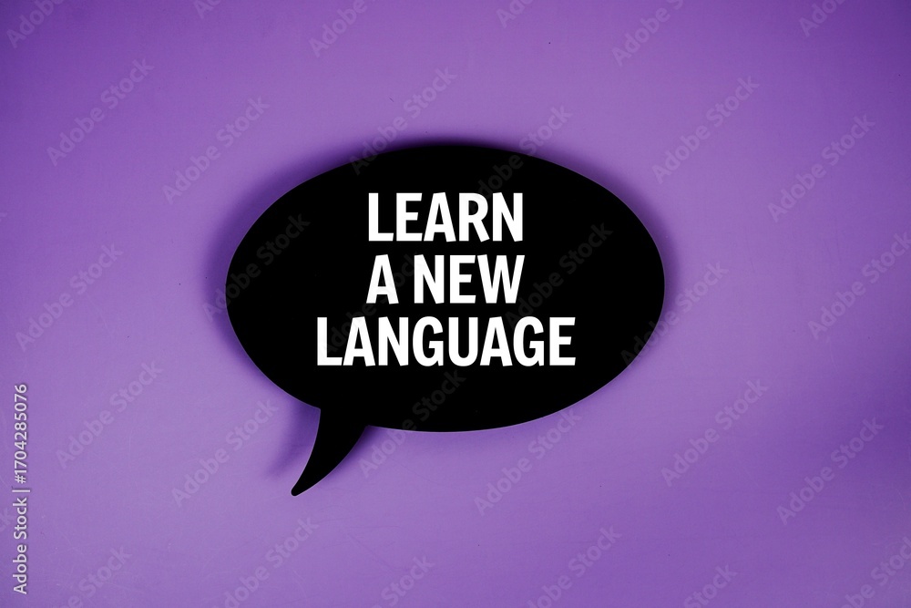 Poster learn a new language text with speech bubble top view on purple background