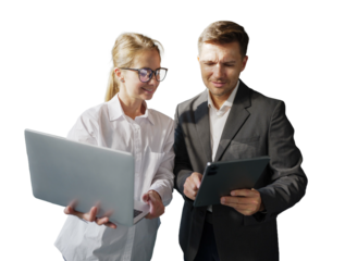 Business partners review project on laptop and tablet in office