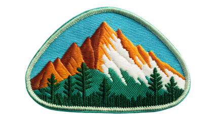 Embroidered mountain patch isolated on transparent background, showcasing a vibrant landscape with orange peaks, green trees, and a serene blue sky