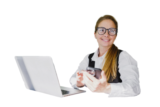 Woman smiles and uses smartphone in front of her Laptop