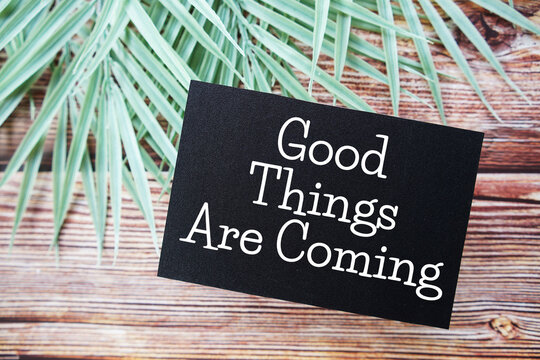 Naklejki Good Things Are Coming Motivational and Inspirational quotes on wooen background
