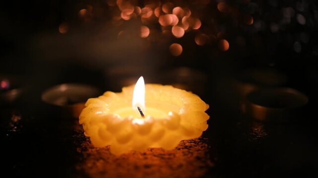 All Saints' Day greeting banner with bokeh effect. All Hallows' Day. Solemnity of All Saints. Burning candle and smoke on shiny background, stock video