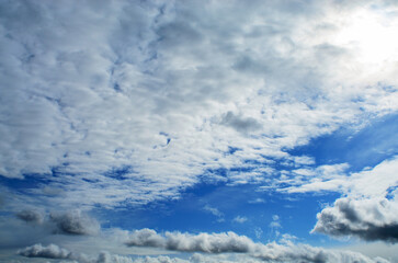 Dramatic sky with layered clouds creating moody atmospheric natural background scene