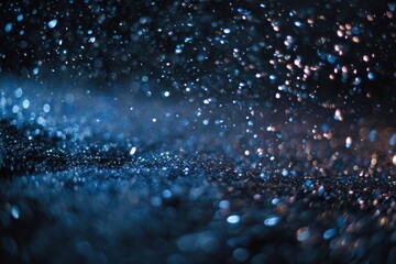 Abstract blue glitter particles with soft bokeh lights